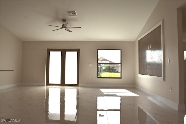 1013 Agnes Ave, Lehigh Acres, FL 33971 - unfurnished room with light marble finish floors, a ceiling fan, baseboards, and lofted ceiling
