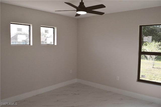 1013 Agnes Ave, Lehigh Acres, FL 33971 - unfurnished room featuring marble finish floors, baseboards, and a ceiling fan