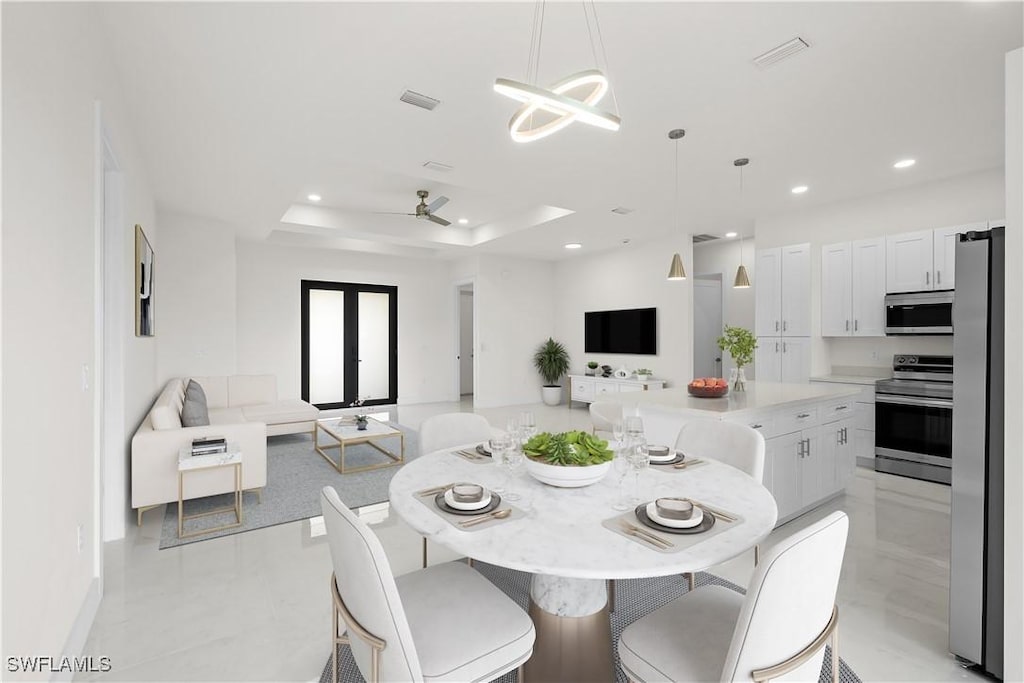 2811 27th St SW, Lehigh Acres, FL 33976 - dining room featuring recessed lighting, a tray ceiling, a ceiling fan, and baseboards