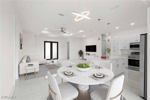 2811 27th St SW, Lehigh Acres, FL 33976 - dining room featuring recessed lighting, a tray ceiling, a ceiling fan, and baseboards