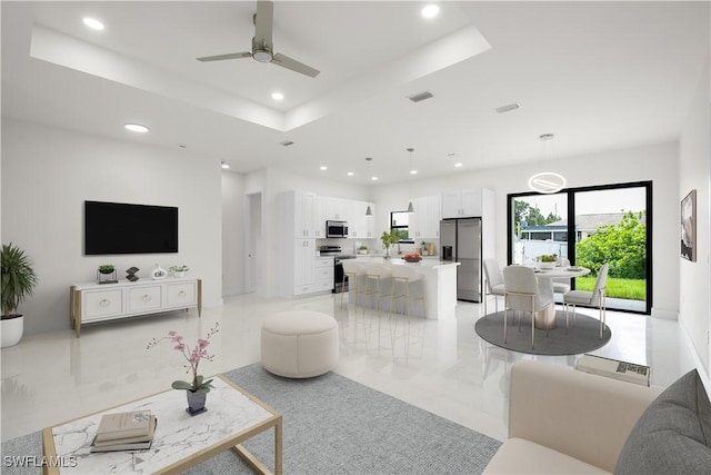 2811 27th St SW, Lehigh Acres, FL 33976 - living area featuring recessed lighting, a raised ceiling, and a ceiling fan