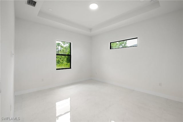 2811 27th St SW, Lehigh Acres, FL 33976 - empty room with a raised ceiling and recessed lighting