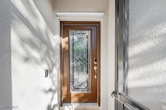 9052 Glenforest Dr, Naples, FL 34120 - property entrance featuring stucco siding