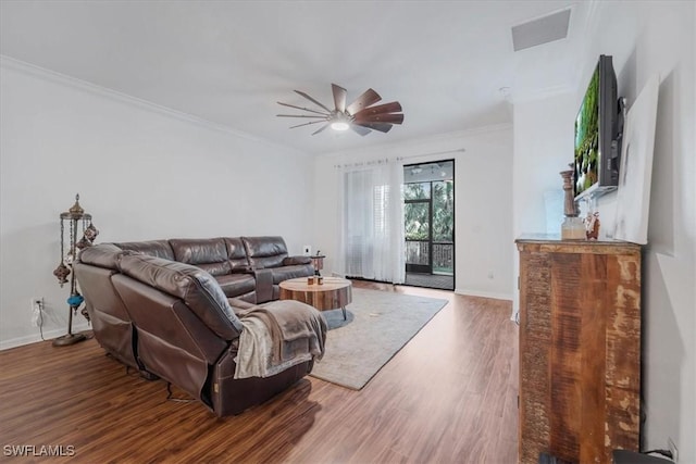 9052 Glenforest Dr, Naples, FL 34120 - living room featuring a ceiling fan, wood finished floors, baseboards, and crown molding