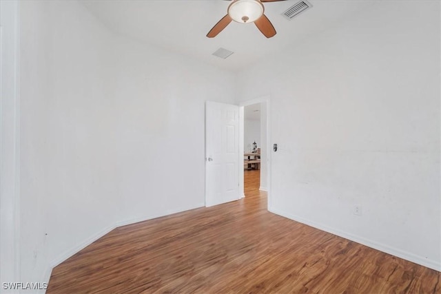 9052 Glenforest Dr, Naples, FL 34120 - unfurnished room with a ceiling fan, wood finished floors, and baseboards