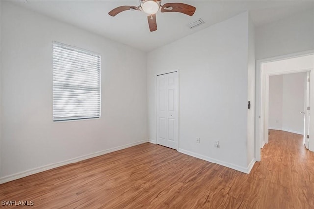 9052 Glenforest Dr, Naples, FL 34120 - unfurnished bedroom with light wood-type flooring, a closet, and baseboards