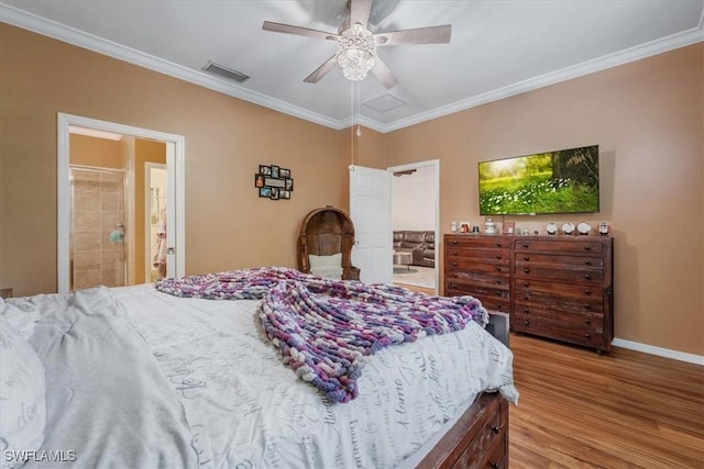 9052 Glenforest Dr, Naples, FL 34120 - bedroom with wood finished floors, ornamental molding, baseboards, ceiling fan, and ensuite bathroom