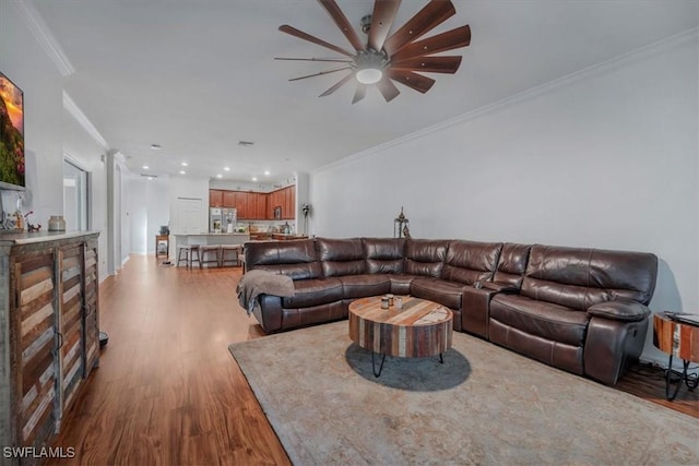 9052 Glenforest Dr, Naples, FL 34120 - living room with a ceiling fan, dark wood-style floors, crown molding, and recessed lighting