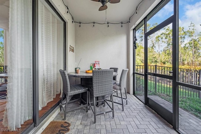 9052 Glenforest Dr, Naples, FL 34120 - sunroom / solarium with a ceiling fan and outdoor dining area