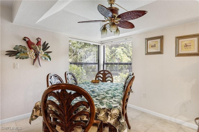 5483 Peppertree Dr Unit 1, Fort Myers, FL 33908 - dining area with light tile patterned floors, baseboards, a textured ceiling, and a ceiling fan