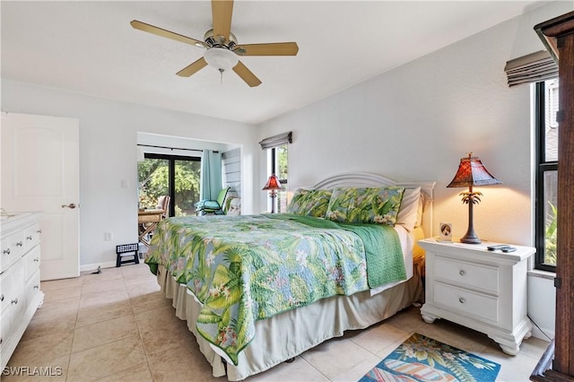 5483 Peppertree Dr Unit 1, Fort Myers, FL 33908 - bedroom featuring access to outside, light tile patterned flooring, a ceiling fan, and baseboards