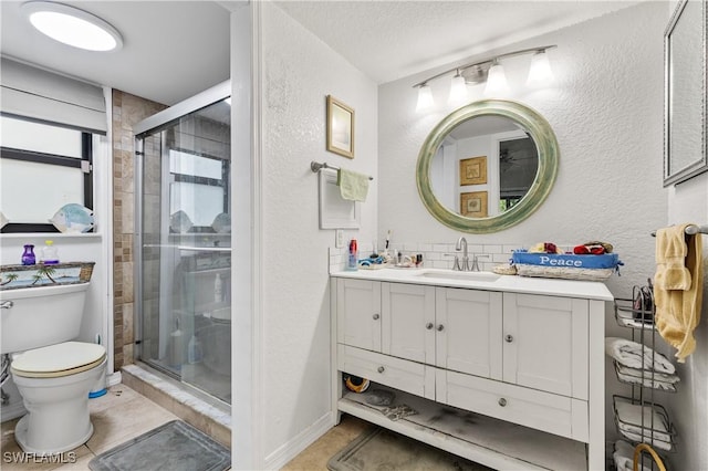5483 Peppertree Dr Unit 1, Fort Myers, FL 33908 - full bathroom featuring a textured wall, toilet, vanity, a stall shower, and tile patterned flooring