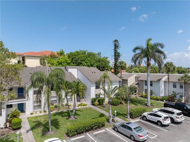 5483 Peppertree Dr Unit 1, Fort Myers, FL 33908 - view of property with uncovered parking and a residential view