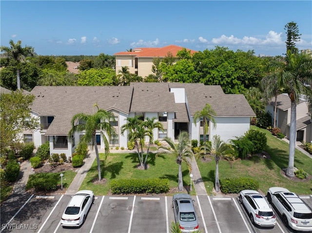 5483 Peppertree Dr Unit 1, Fort Myers, FL 33908 - view of property with uncovered parking and a residential view