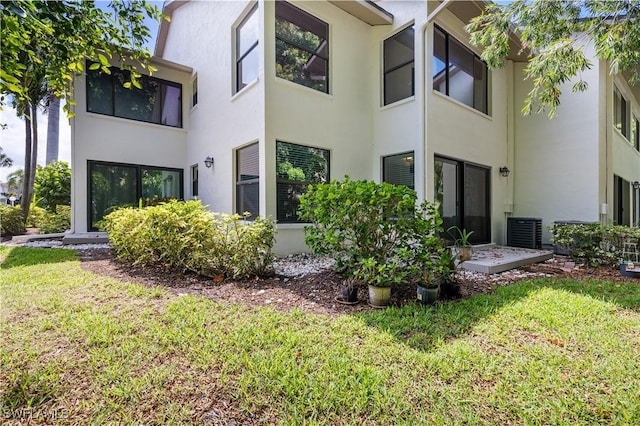 5483 Peppertree Dr Unit 1, Fort Myers, FL 33908 - view of building exterior featuring central air condition unit