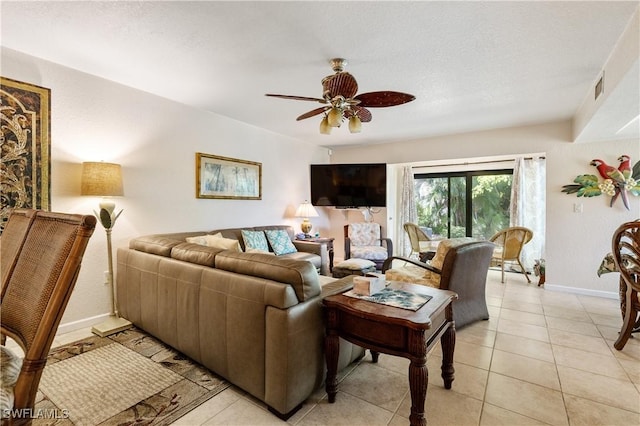5483 Peppertree Dr Unit 1, Fort Myers, FL 33908 - living room with a ceiling fan, baseboards, and light tile patterned flooring