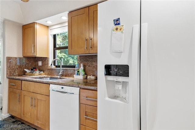 5483 Peppertree Dr Unit 1, Fort Myers, FL 33908 - kitchen featuring white appliances, a sink, backsplash, lofted ceiling, and stone countertops