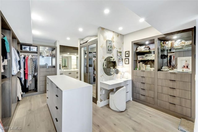 6001 Pelican Bay Blvd Unit 1405, Naples, FL 34108 - walk in closet featuring light wood-style floors