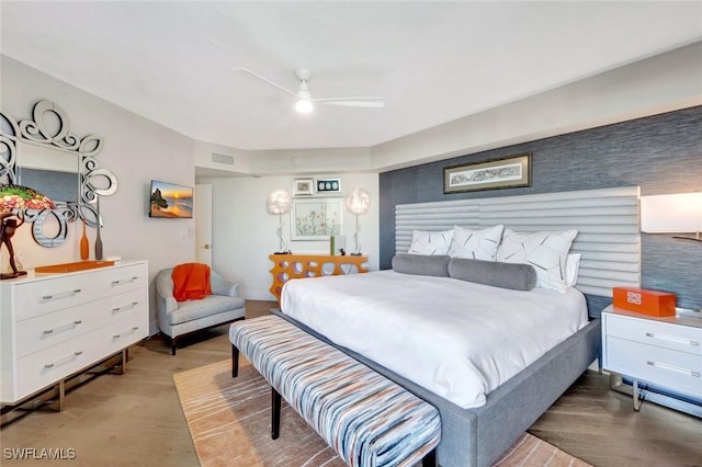 6001 Pelican Bay Blvd Unit 1405, Naples, FL 34108 - bedroom with wood finished floors and ceiling fan