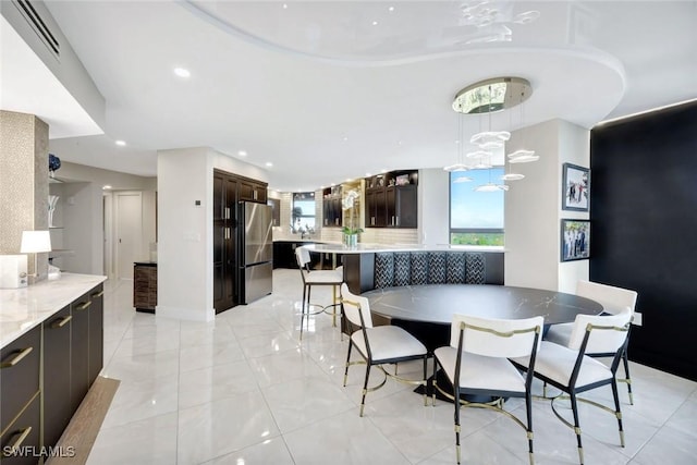 6001 Pelican Bay Blvd Unit 1405, Naples, FL 34108 - dining area with recessed lighting and light tile patterned floors