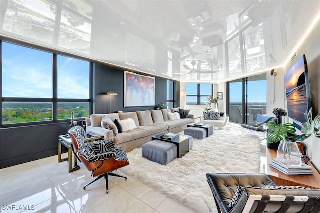 6001 Pelican Bay Blvd Unit 1405, Naples, FL 34108 - tiled living room with healthy amount of natural light and a towering ceiling