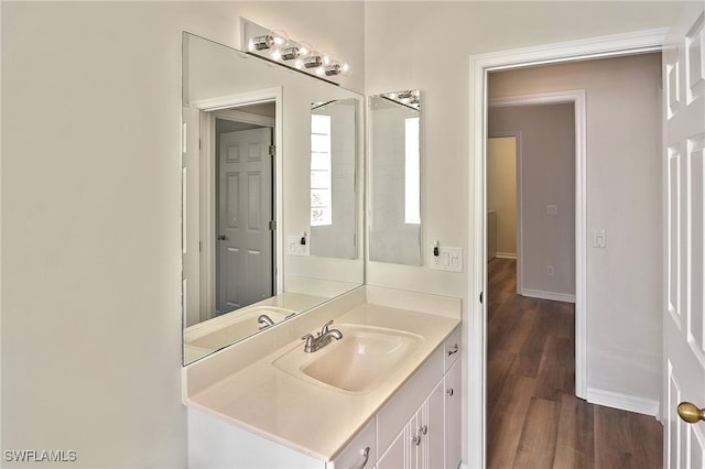 19741 Vintage Trace Cir, Estero, FL 33967 - bathroom with vanity, baseboards, and wood finished floors