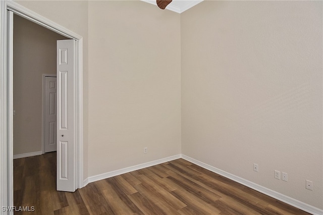 19741 Vintage Trace Cir, Estero, FL 33967 - spare room featuring dark wood-style floors, baseboards, and ornamental molding
