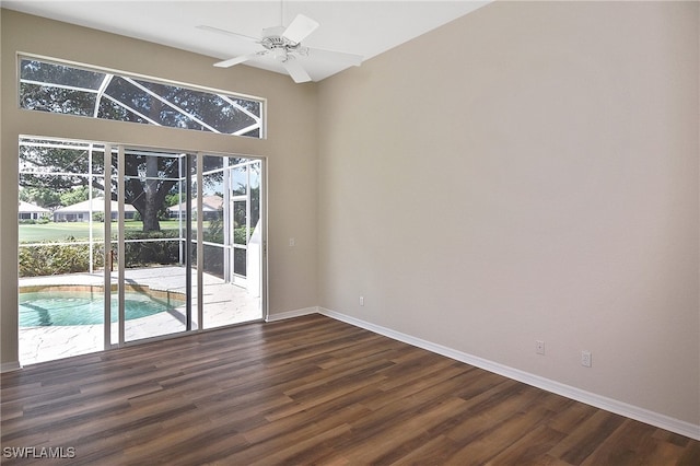 19741 Vintage Trace Cir, Estero, FL 33967 - spare room with healthy amount of natural light, dark wood-type flooring, and baseboards