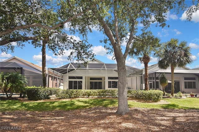 19741 Vintage Trace Cir, Estero, FL 33967 - rear view of property featuring glass enclosure