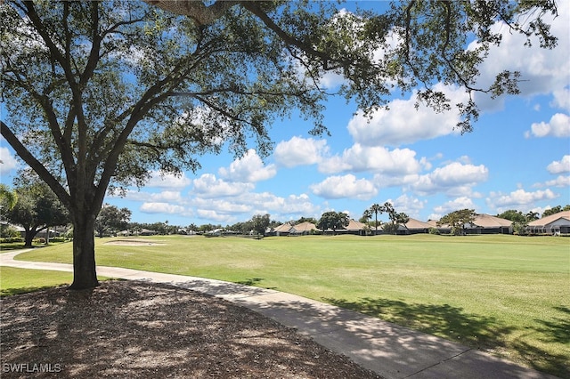 19741 Vintage Trace Cir, Estero, FL 33967 - surrounding community featuring a residential view and a yard