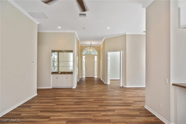 19741 Vintage Trace Cir, Estero, FL 33967 - foyer entrance featuring wood finished floors, ornamental molding, baseboards, and recessed lighting