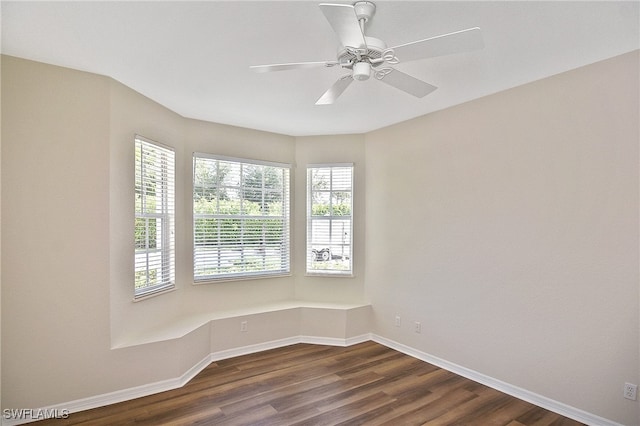 19741 Vintage Trace Cir, Estero, FL 33967 - empty room with dark wood finished floors, baseboards, and a ceiling fan