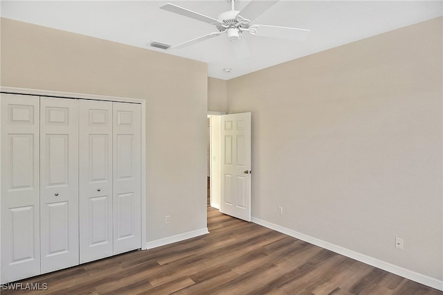 19741 Vintage Trace Cir, Estero, FL 33967 - unfurnished bedroom with dark wood-type flooring, baseboards, and a closet