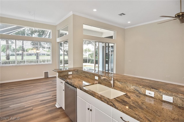 19741 Vintage Trace Cir, Estero, FL 33967 - kitchen featuring a sink, stainless steel dishwasher, wood finished floors, white cabinets, and crown molding