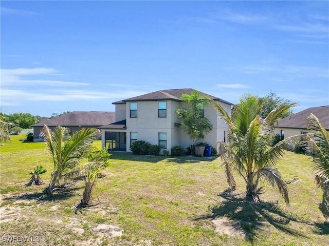 154 Shadowview Ct, Lehigh Acres, FL 33974 - view of front of property featuring a front yard and stucco siding
