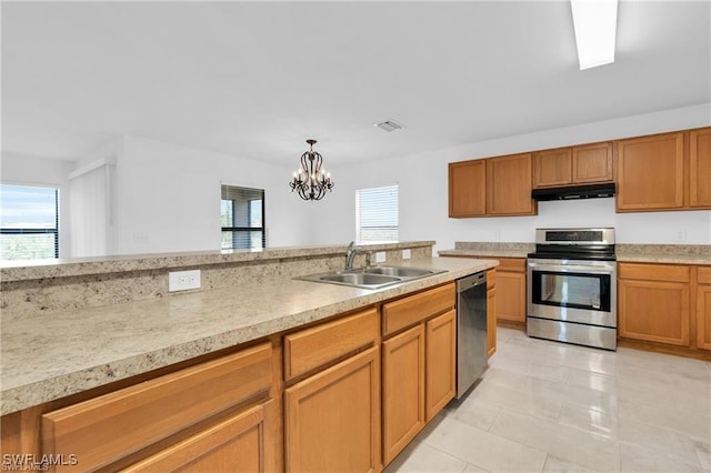 154 Shadowview Ct, Lehigh Acres, FL 33974 - kitchen with stainless steel appliances, ventilation hood, a sink, and light countertops
