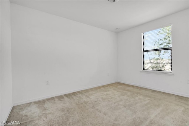 154 Shadowview Ct, Lehigh Acres, FL 33974 - carpeted spare room with baseboards