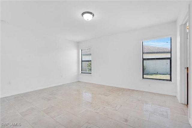 154 Shadowview Ct, Lehigh Acres, FL 33974 - empty room featuring baseboards