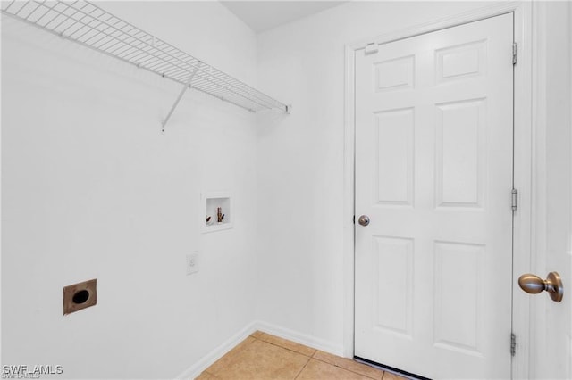 154 Shadowview Ct, Lehigh Acres, FL 33974 - laundry room with electric dryer hookup, washer hookup, baseboards, and light tile patterned floors