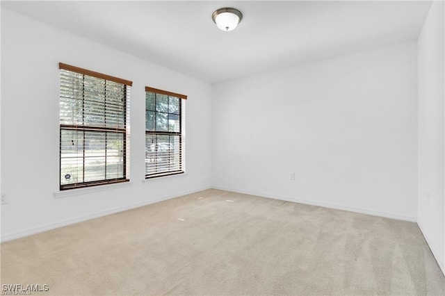 154 Shadowview Ct, Lehigh Acres, FL 33974 - spare room with light colored carpet and baseboards