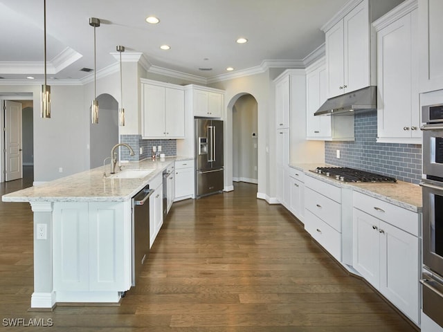 4771 Via Del Corso Ln Unit 302, Bonita Springs, FL 34134 - kitchen featuring a sink, arched walkways, a peninsula, appliances with stainless steel finishes, and under cabinet range hood