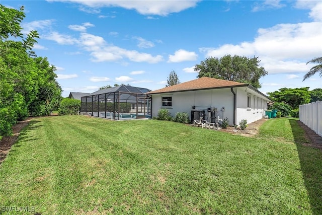10268 Boca Cir, Naples, FL 34109 - back of property with stucco siding, a swimming pool, and a lanai