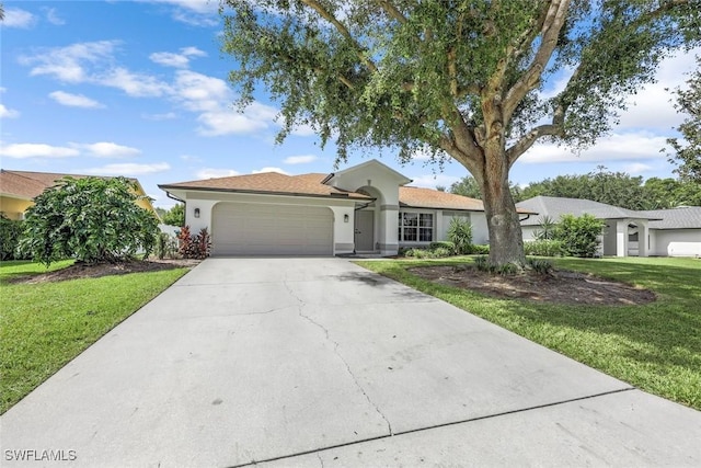 10268 Boca Cir, Naples, FL 34109 - ranch-style home featuring an attached garage, stucco siding, a front yard, and driveway