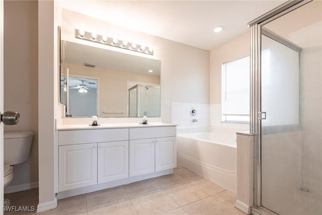 2121 NW 18th Pl, Cape Coral, FL 33993 - full bath with toilet, double vanity, a garden tub, a stall shower, and tile patterned flooring