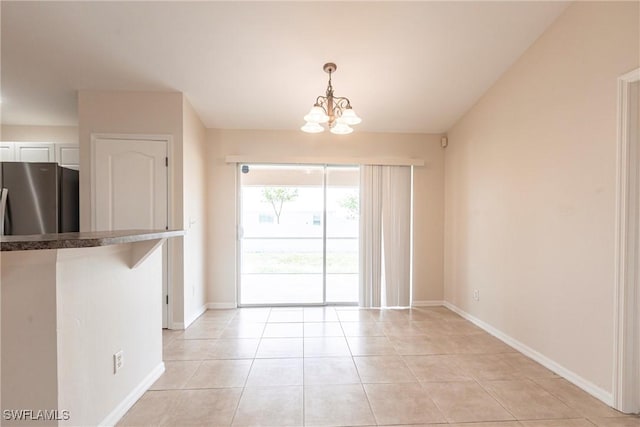 2121 NW 18th Pl, Cape Coral, FL 33993 - unfurnished dining area with a chandelier, baseboards, and light tile patterned flooring