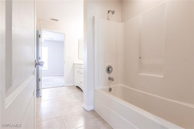 2121 NW 18th Pl, Cape Coral, FL 33993 - bathroom with shower / bath combination, vanity, tile patterned floors, and baseboards