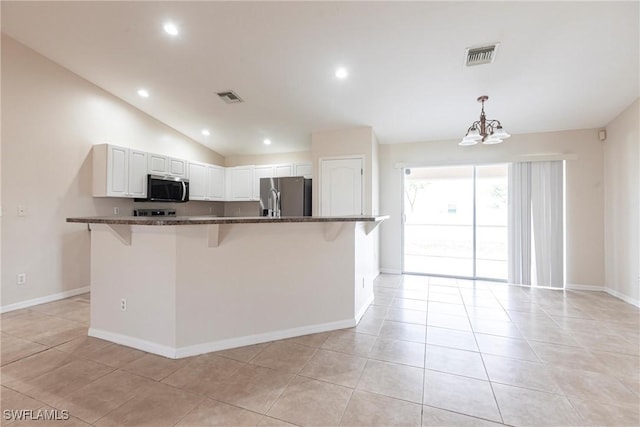 2121 NW 18th Pl, Cape Coral, FL 33993 - kitchen with stainless steel appliances, a breakfast bar area, a chandelier, light tile patterned floors, and white cabinets