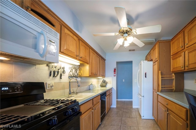 4 Desert Candle Cir, Lehigh Acres, FL 33936 - kitchen featuring black appliances, a sink, backsplash, ceiling fan, and light countertops