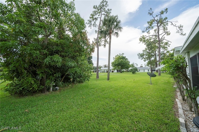 4 Desert Candle Cir, Lehigh Acres, FL 33936 - view of green lawn