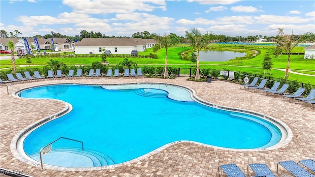 1267 Brumfield Xing, Fort Myers, FL 33905 - community pool featuring a patio, a water view, and a residential view